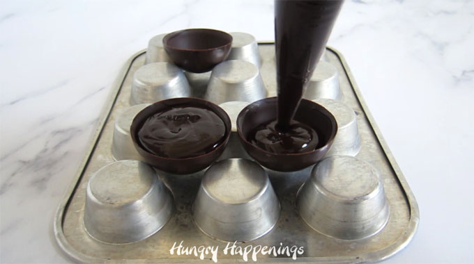 Fill chocolate shells with chocolate ganache to make hot chocolate bombs.