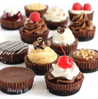 Mini chocolate cheesecakes are topped with whipped cream, chocolate ganache, caramel, peanut butter mousse, peppermint mousse, chocolate mousse, and more.