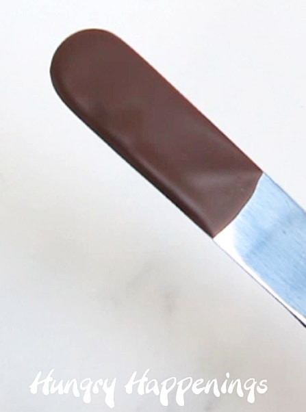 dip a metal spatula in your tempered chocolate then set aside for five minutes to see if the chocolate hardens and looks shiny