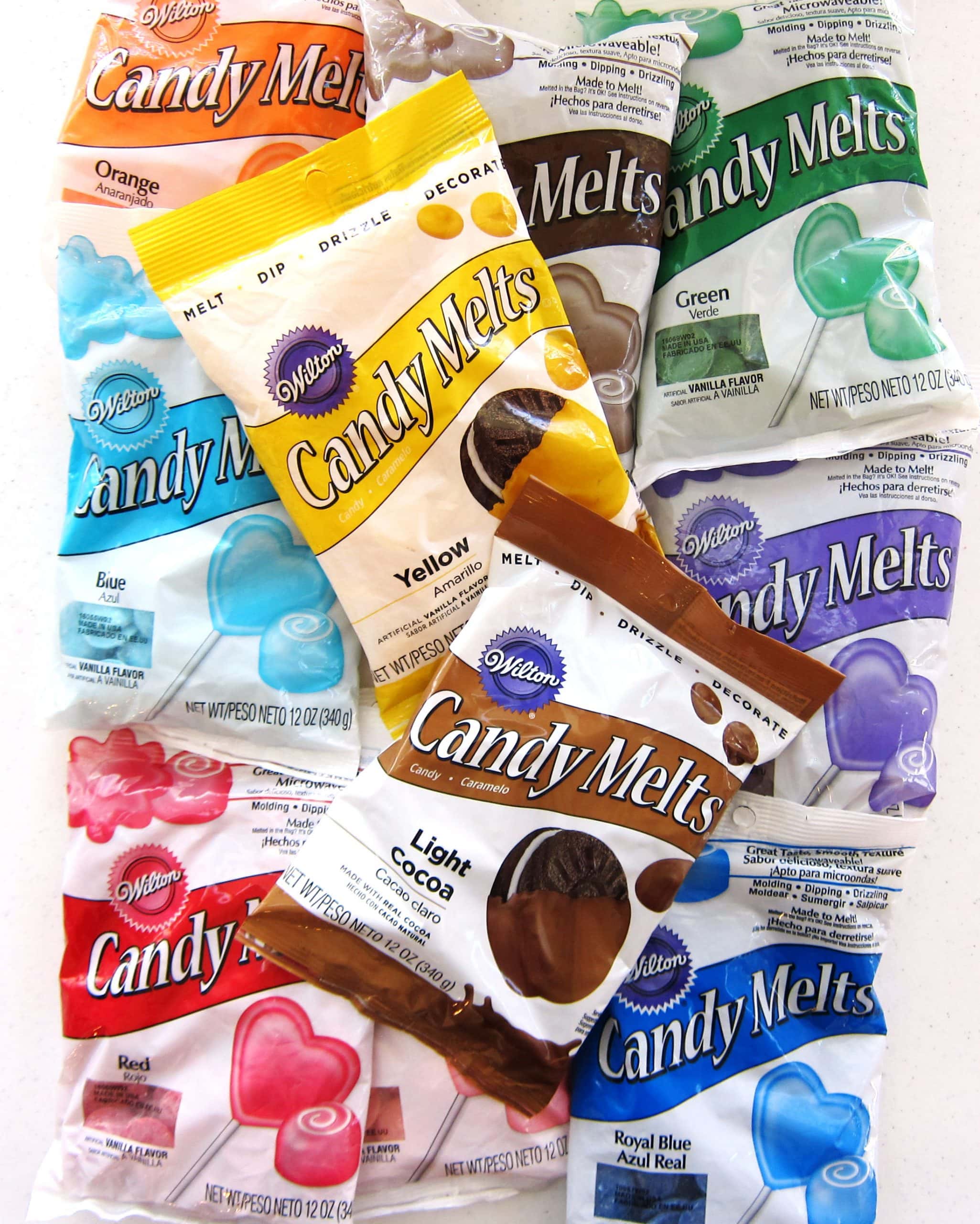 Wilton Candy Melts in yellow, blue, purple, red, green, pink, and cocoa