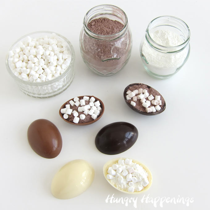milk chocolate, white chocolate, and dark chocolate Easter egg hot chocolate bombs filled with hot cocoa mix and marshmallows
