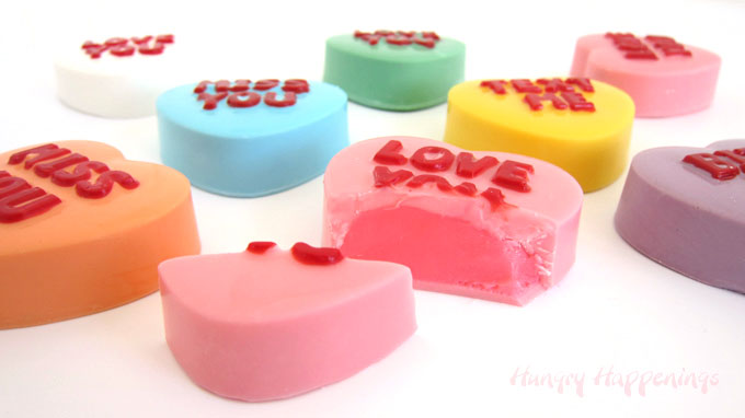 colorful conversation heart truffles are filled with colored white chocolate ganache