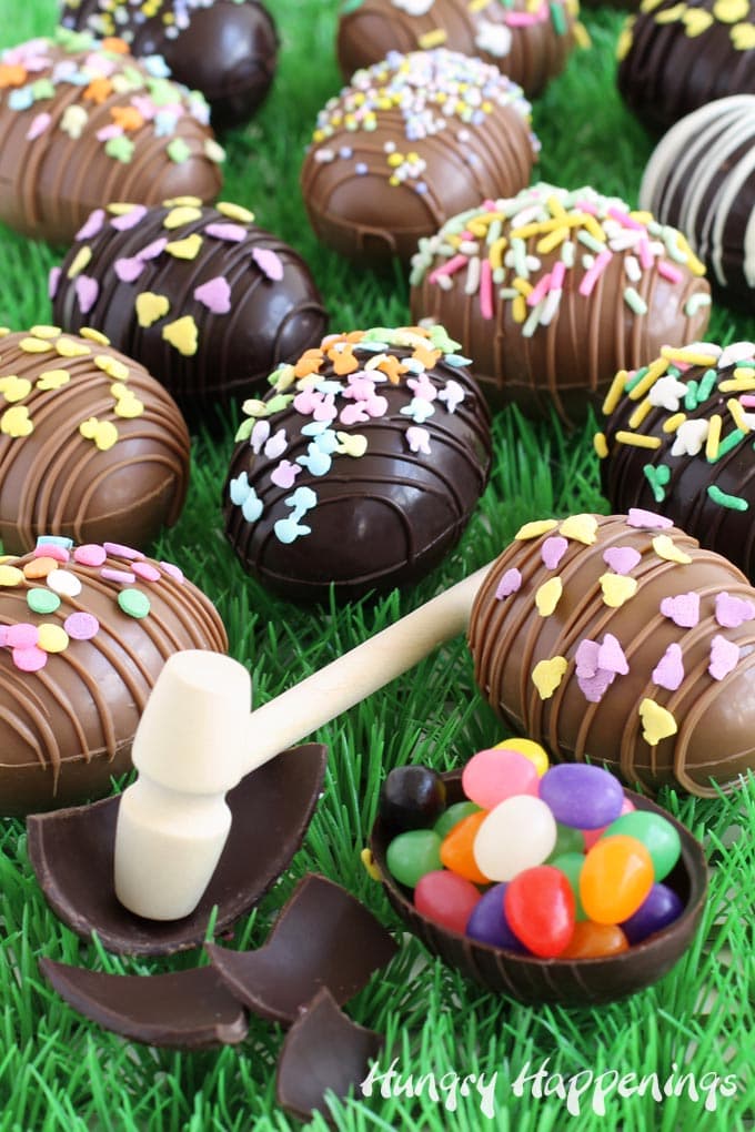 Crack open a breakable chocolate Easter egg to find candy hiding inside.