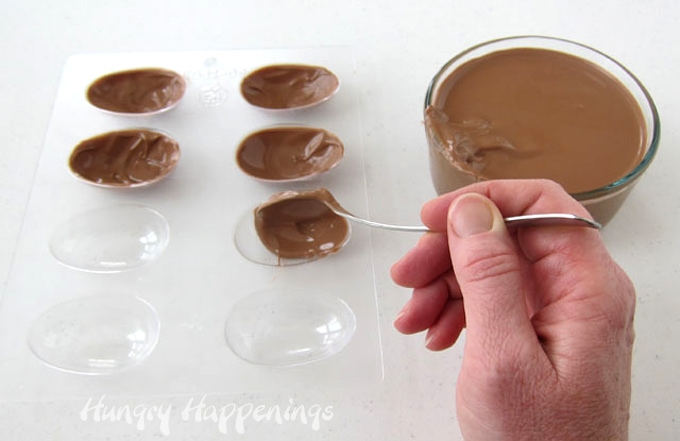 Make chocolate egg shells by brushing chocolate over the bottom and up the sides of a plastic egg candy mold. 