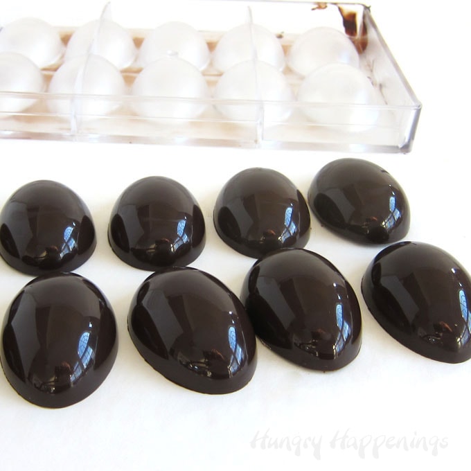Make shiny chocolate Easter eggs using tempered pure chocolate and polycarbonate egg molds.