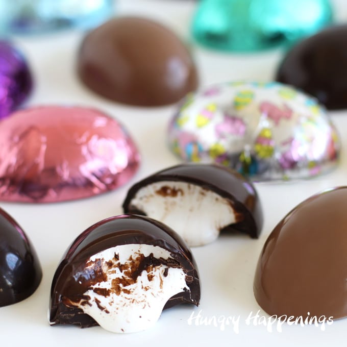 Chocolate marshmallow creme eggs wrapped in colorful Easter foil wrappers.