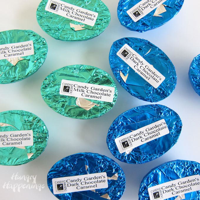 Milk chocolate caramel eggs and dark chocolate caramel eggs with labels on the blue and teal foil.