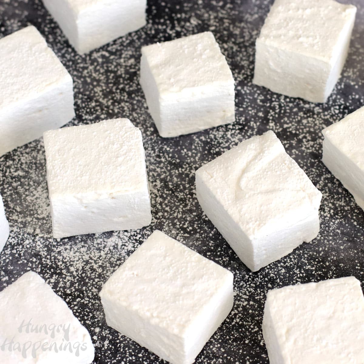 Billowy soft homemade marshmallows are dusted with a blend of powdered sugar and corn starch to keep them from sticking to each other.