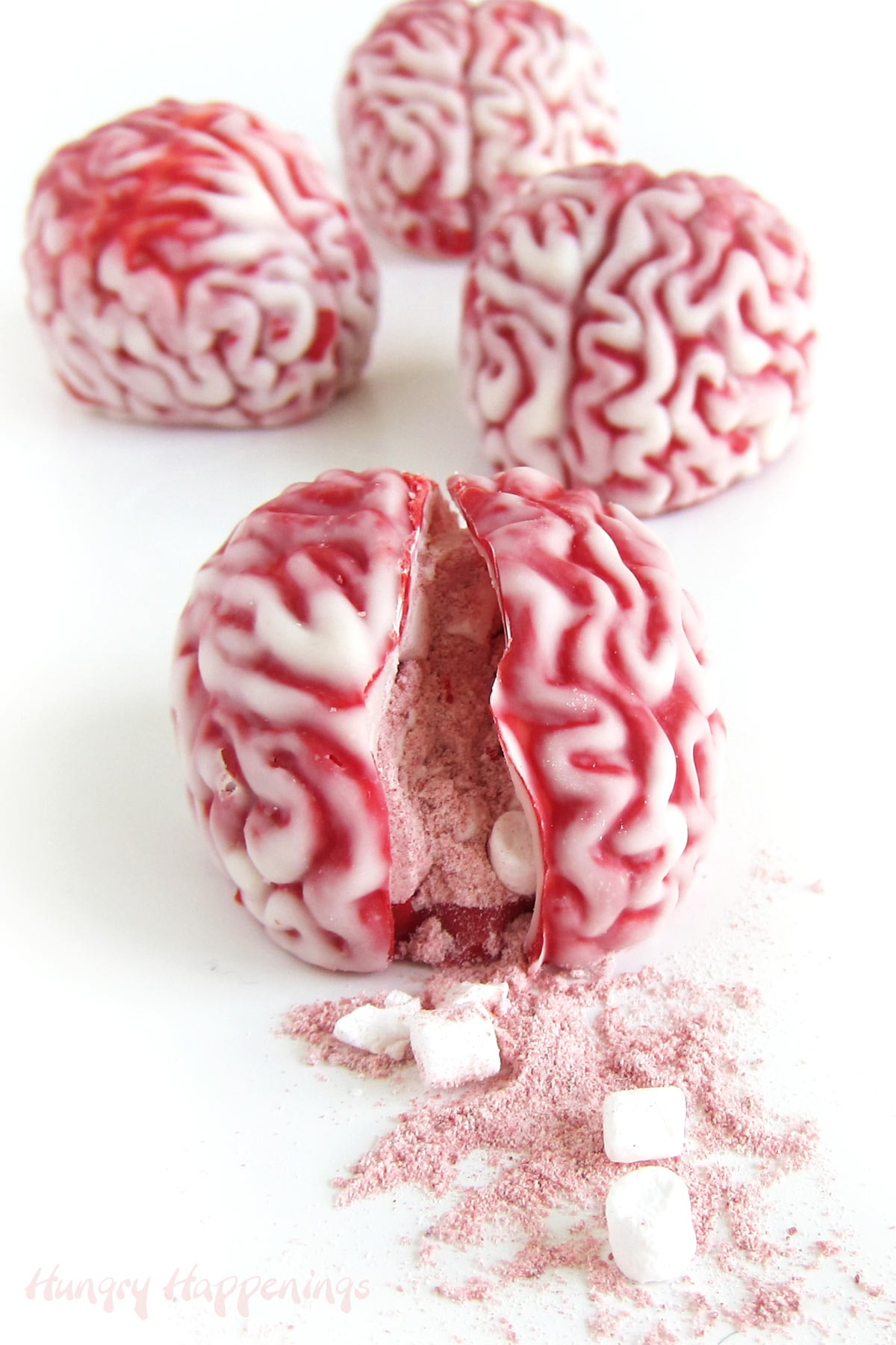 Halloween hot chocolate bomb brains filled with strawberry hot cocoa mix and dehydrated marshmallows. 