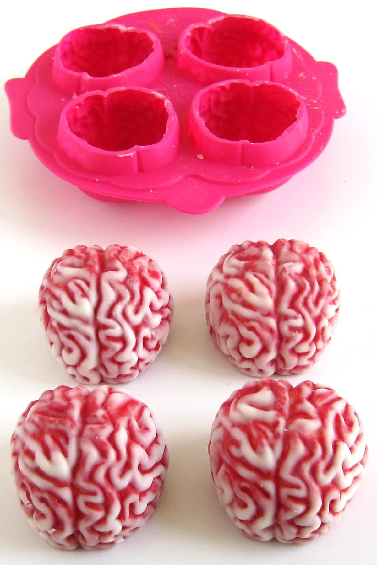 Brain-shaped hot chocolate bombs made using a silicone brain mold.