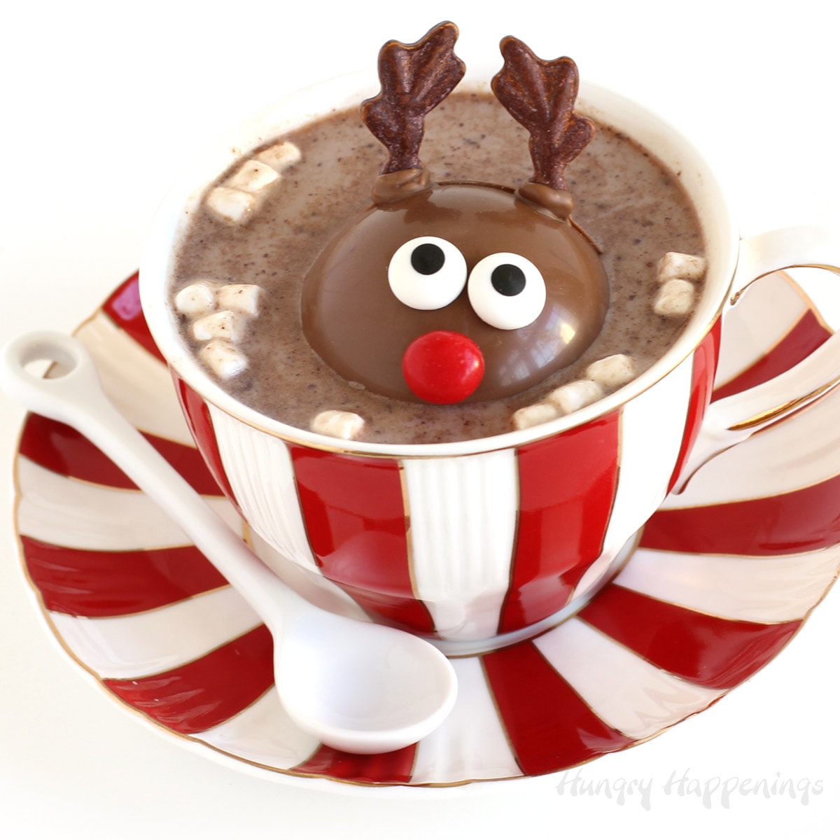 Reindeer Hot Chocolate Bombs melting in a mug of hot milk.