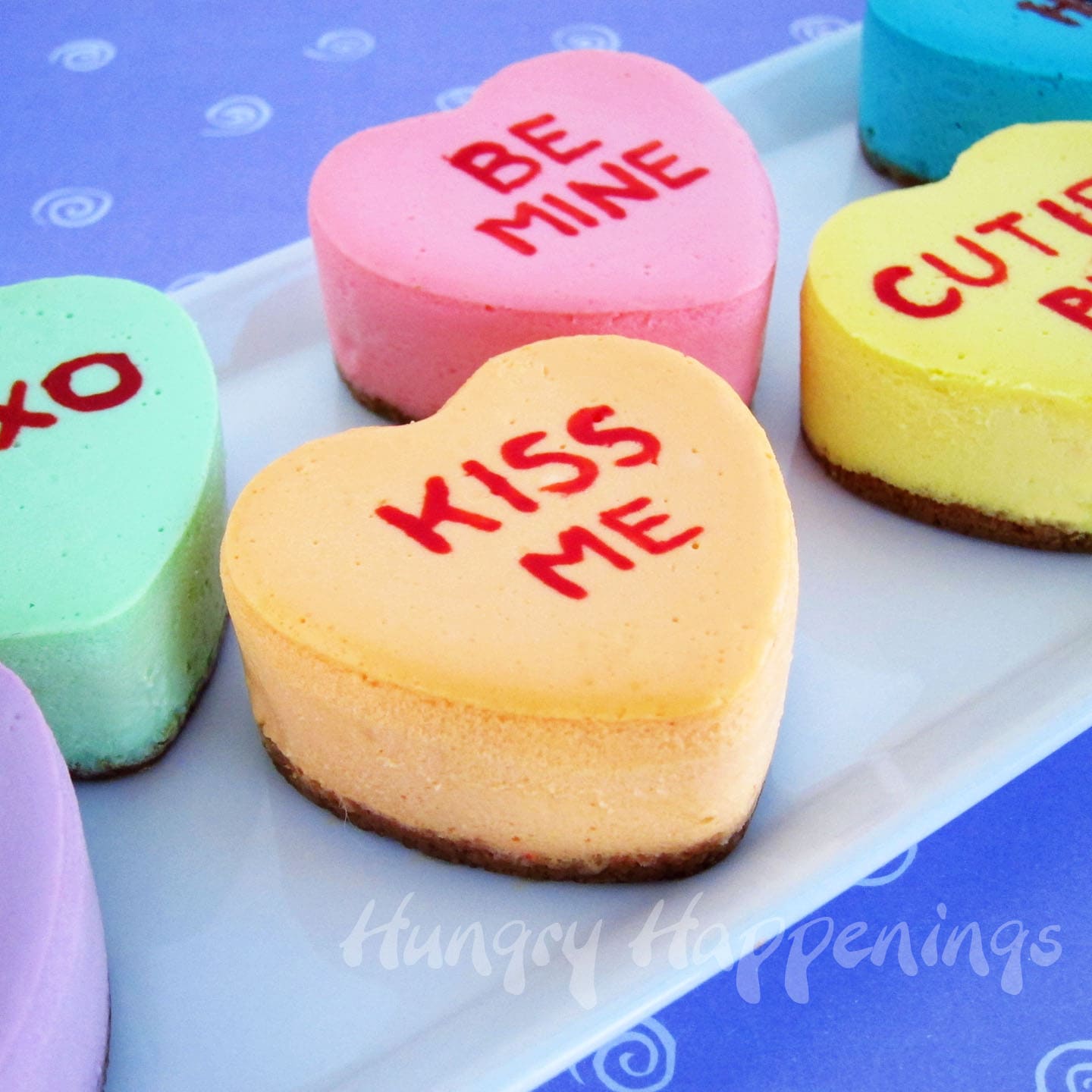 homemade conversation heart cheesecakes decorated with sweet Valentine's Day phrases