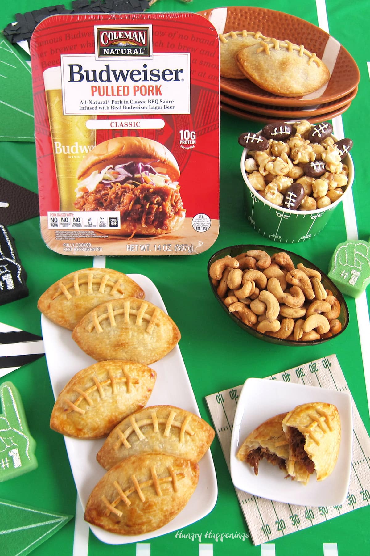 football appetizers - Budweiser Pulled Pork-filled football-shaped pastry pockets served with other game-day snacks