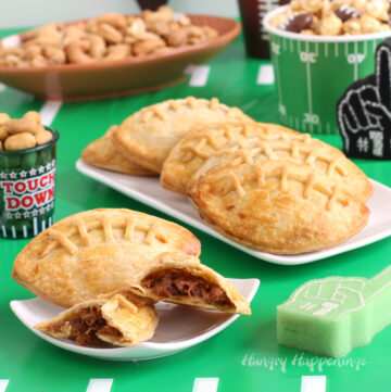 pulled pork-filled football-shaped pastry pockets