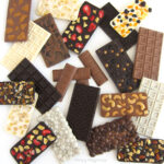 homemade candy bars including dark chocolate bars, milk chocolate cashew bars, white chocolate cookies and cream candy bars, and more