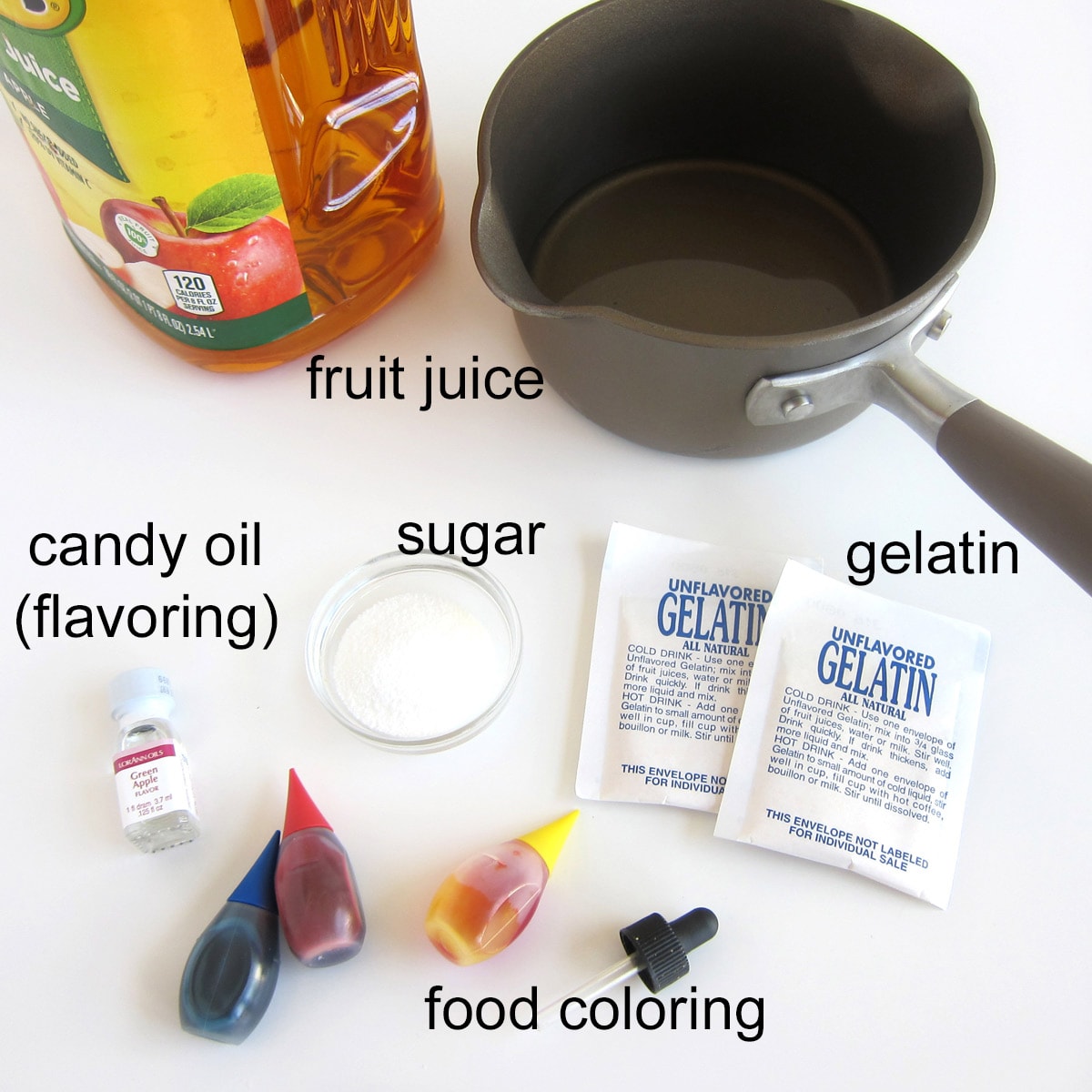 fruit juice gummy bear recipe ingredients including apple juice, sugar, gelatin, candy oil, and food coloring.