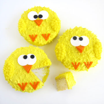 lemon cake chicks decorated with modeling chocolate or fondant eyes, beak, and feet
