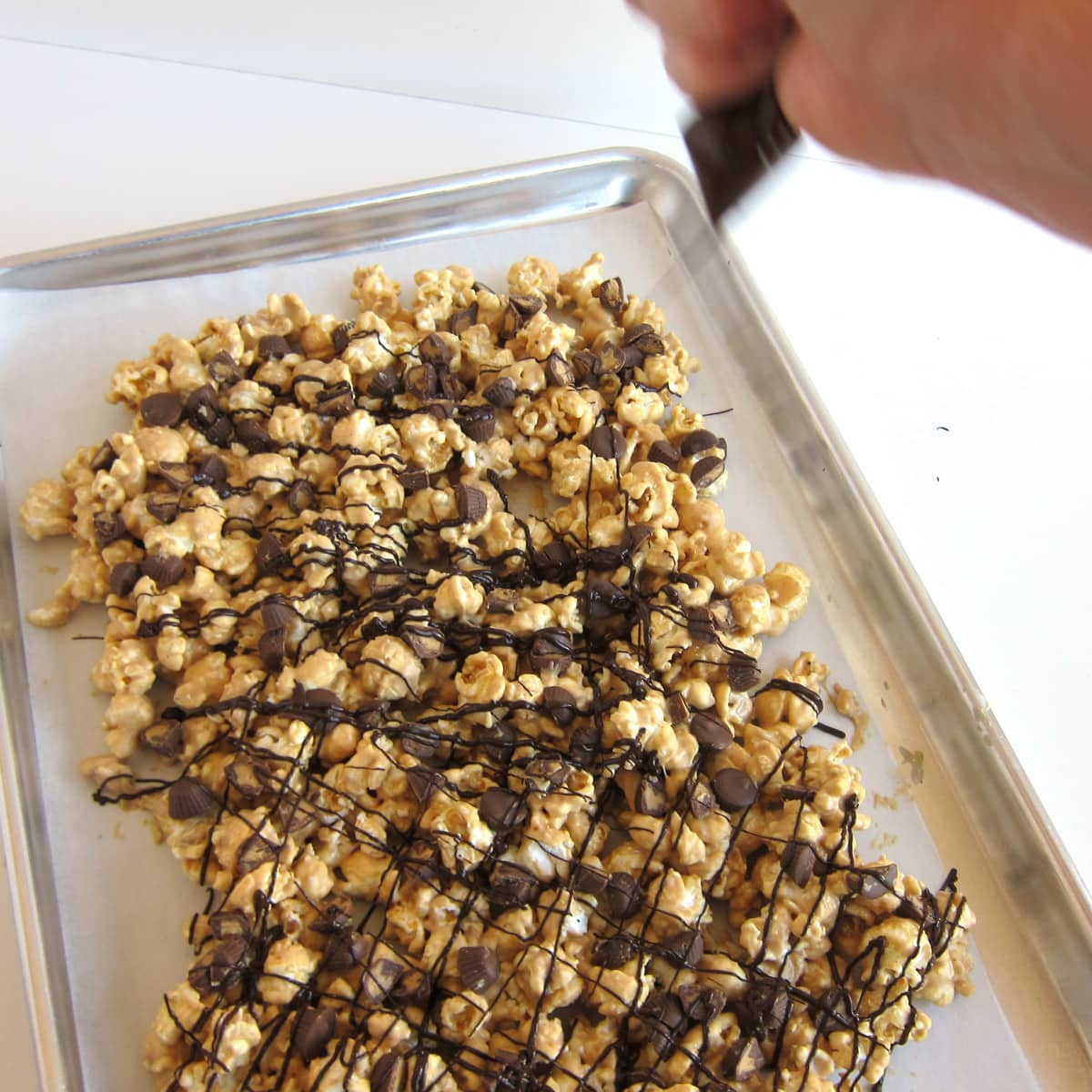 drizzle chocolate over peanut butter popcorn