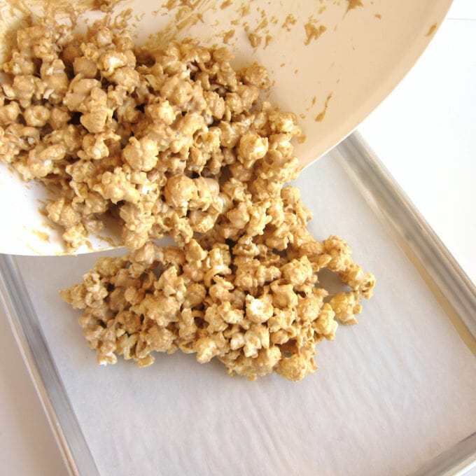 pour peanut butter popcorn onto baking pan