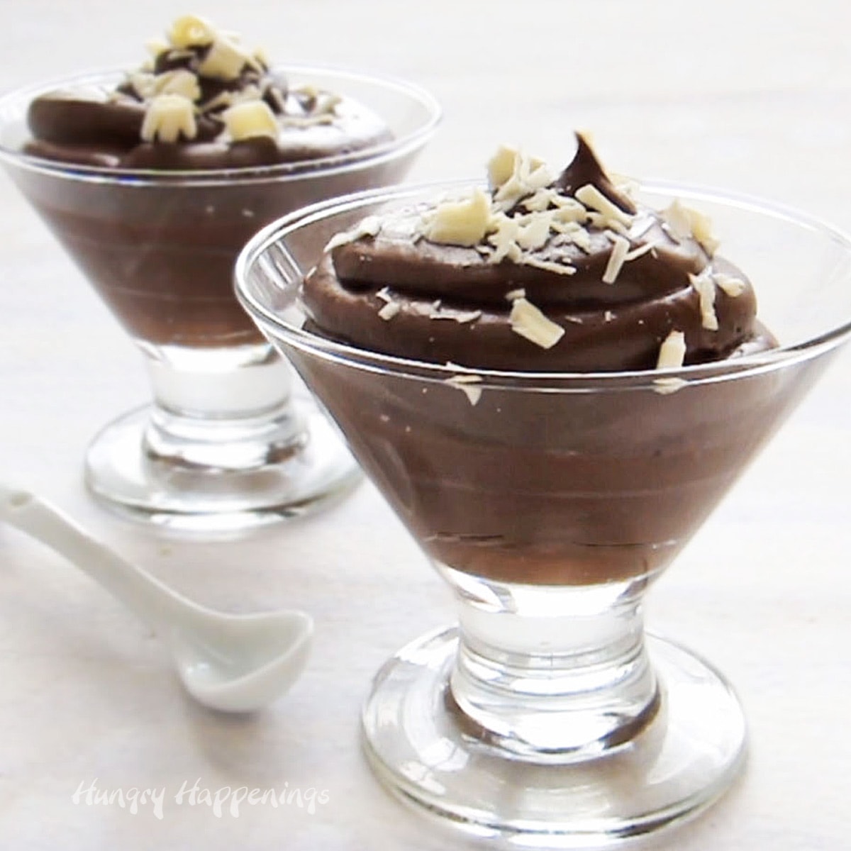 best chocolate mousse topped with white chocolate shavings and served in clear dessert cups