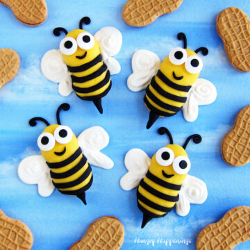 bumble bee cookies decorated surrounded by Nutter Butter cookies
