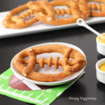 soft pretzel footballs served with mustard and cheese on a Super Bowl football napkin