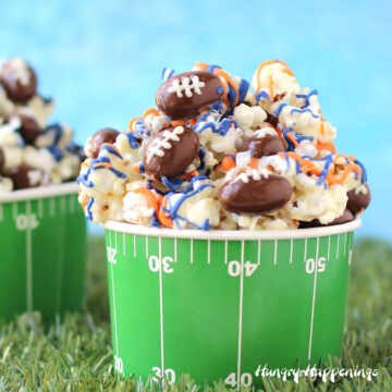 white chocolate popcorn filled with chocolate almond footballs serve in a football field cup