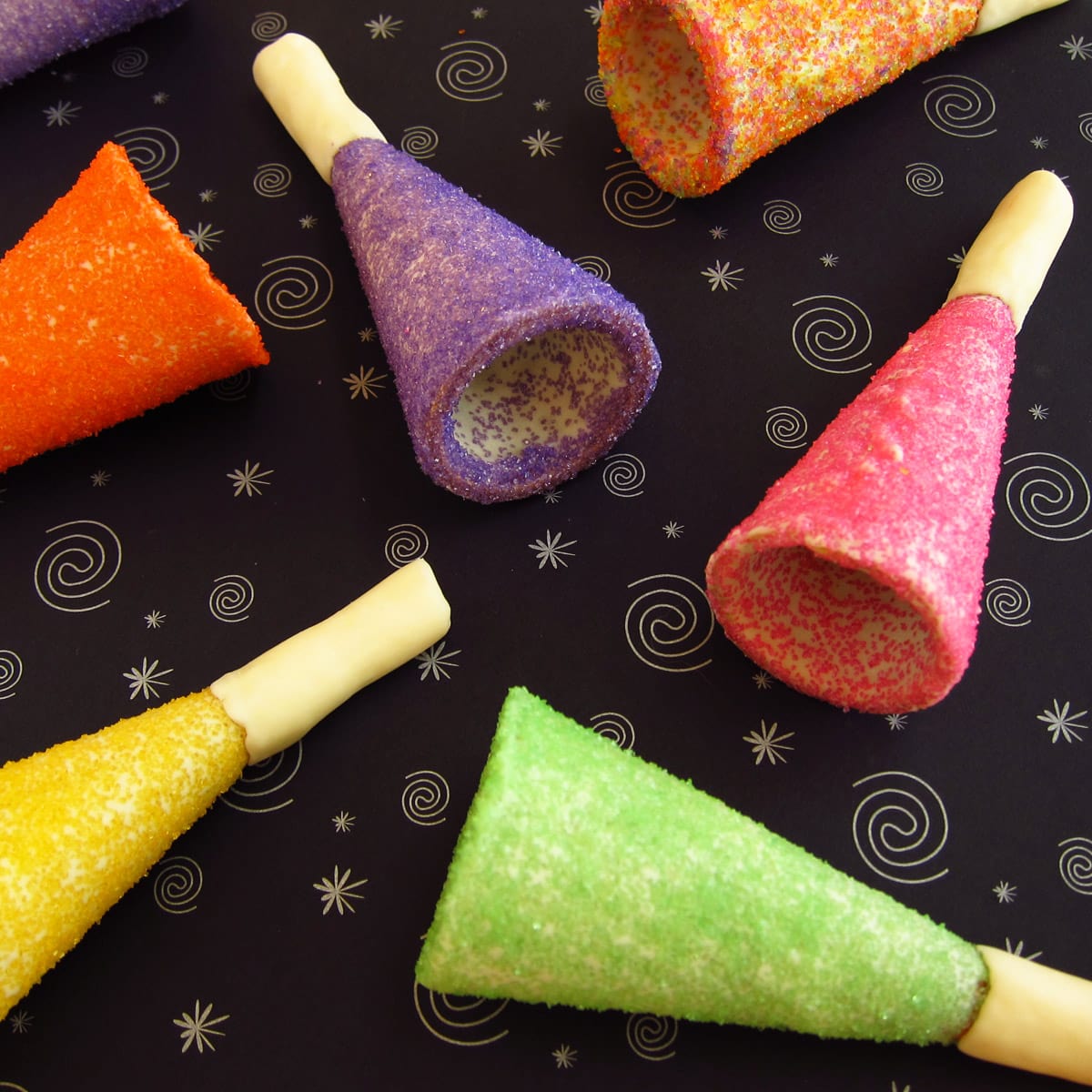 sugar cone party horns covered in colorful sugar.