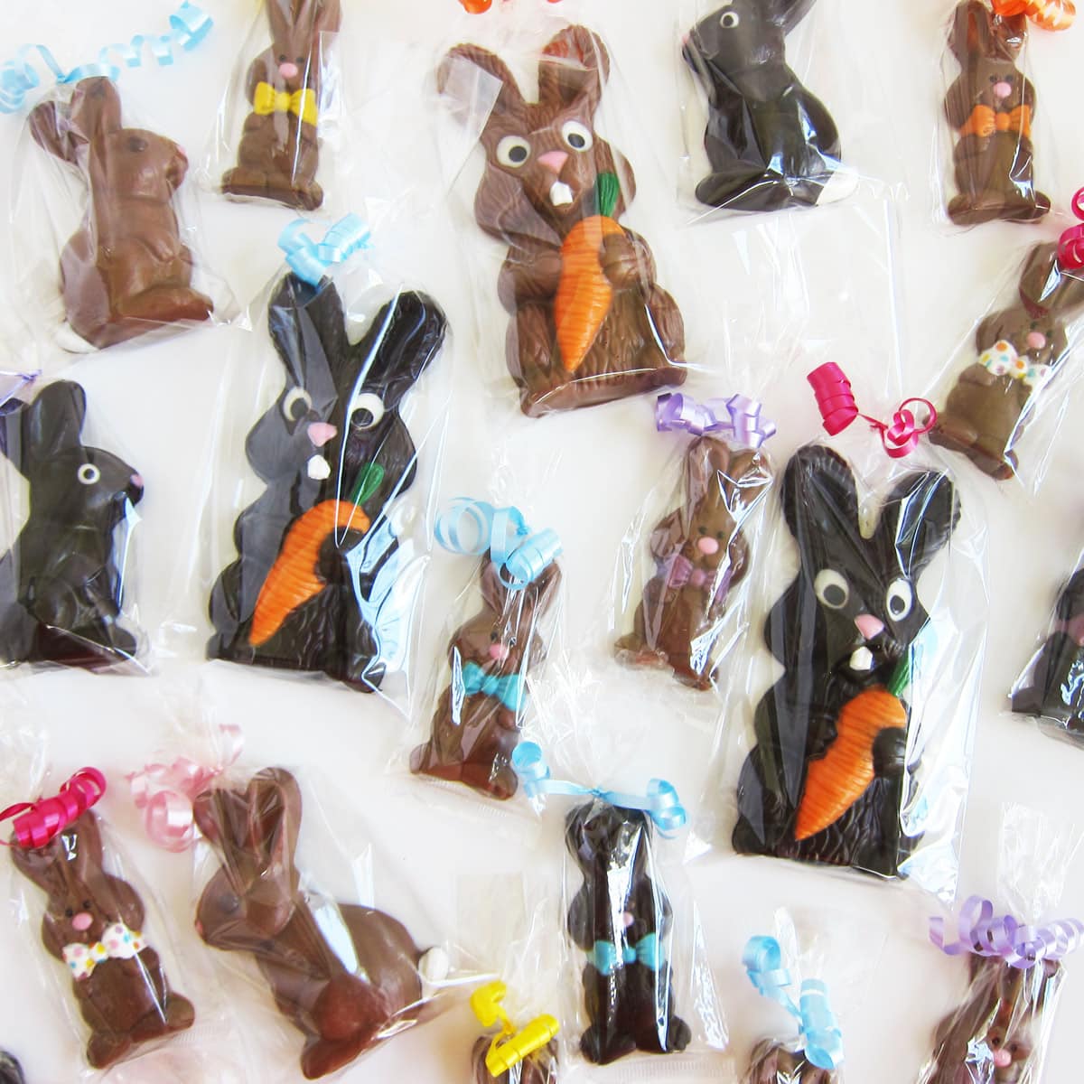 chocolate Easter bunnies packaged in clear cellophane bags tied with curling ribbon