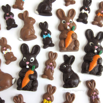 Handmade chocolate Easter bunnies are painted with colored white chocolate.