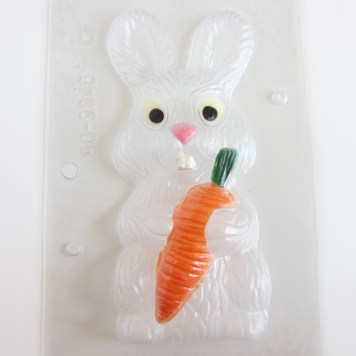 The bunny with carrot chocolate mold is painted with orange, green, white, and pink candy melts.
