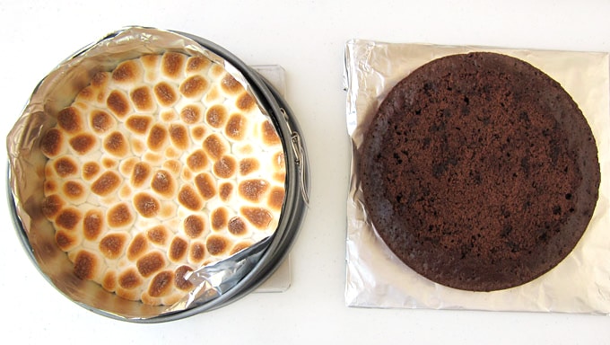 toasted marshmallow topped graham cracker crust set next to brownie cake layer