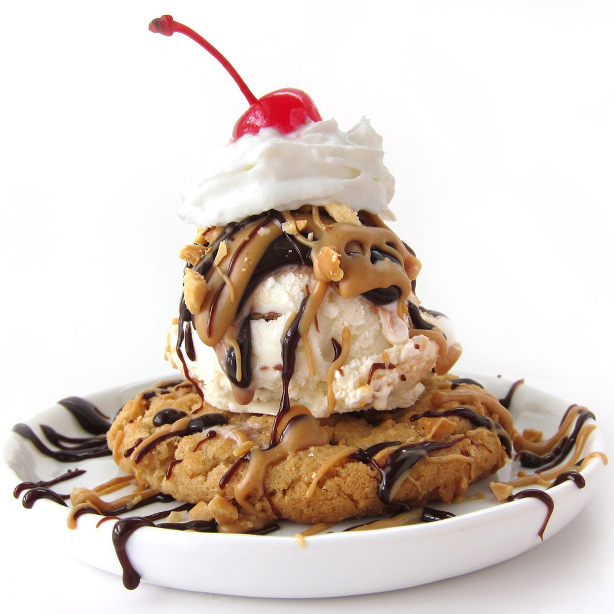 ice cream recipes featuring a peanut butter and chocolate ice cream sundae on a peanut butter cookie