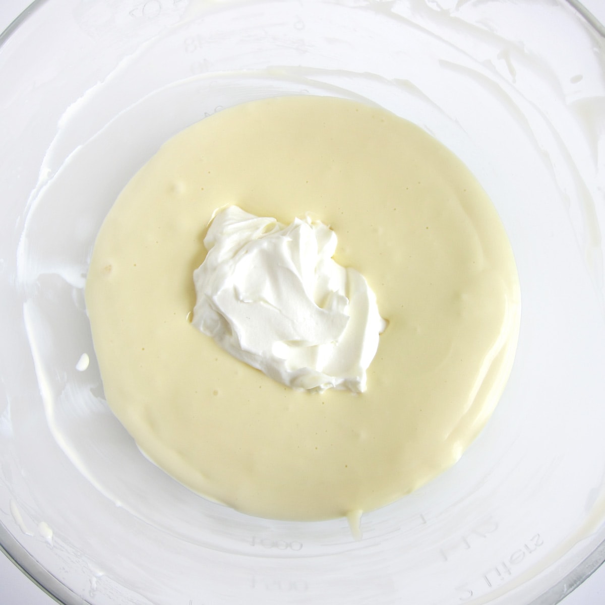 Add sour cream to the cheesecake filling.