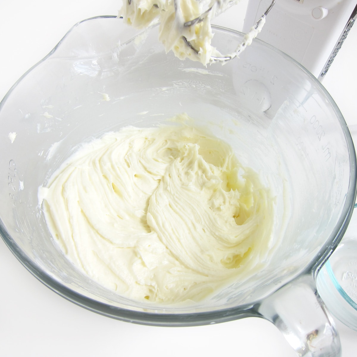 Cream cheese and sugar beaten until creamy in a mixing bowl with mixer.