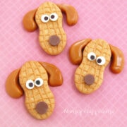 cookie dogs Nutter Butter puppies with white chocolate eyes, milk chocolate noses, and caramel ears.
