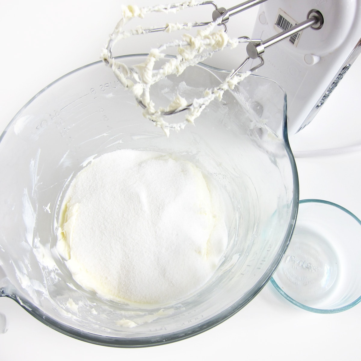 Sugar added to bowl of whipped cream cheese.