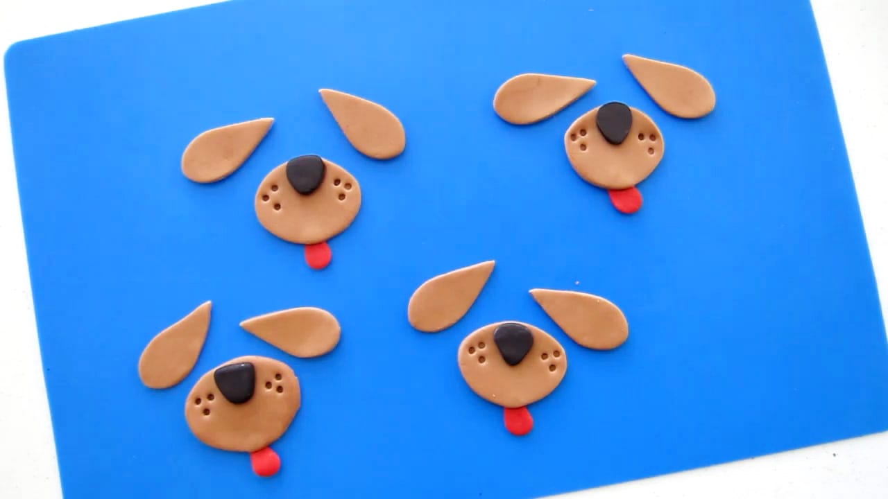 modeling chocolate dog features including ears, snout, nose, and tongue.