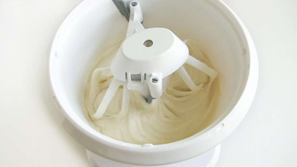 white cake mix batter in a mixer