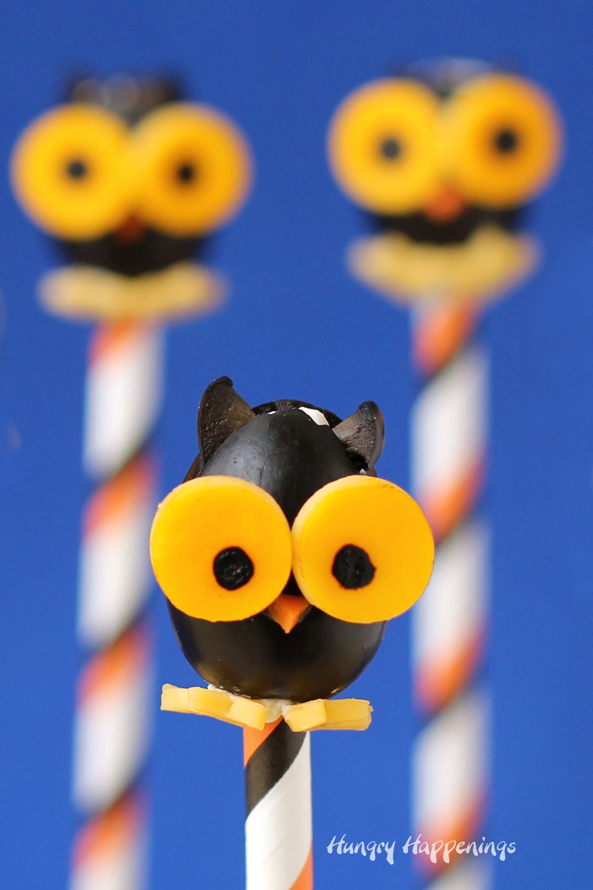 cute Halloween appetizers black olive owl lollipops.