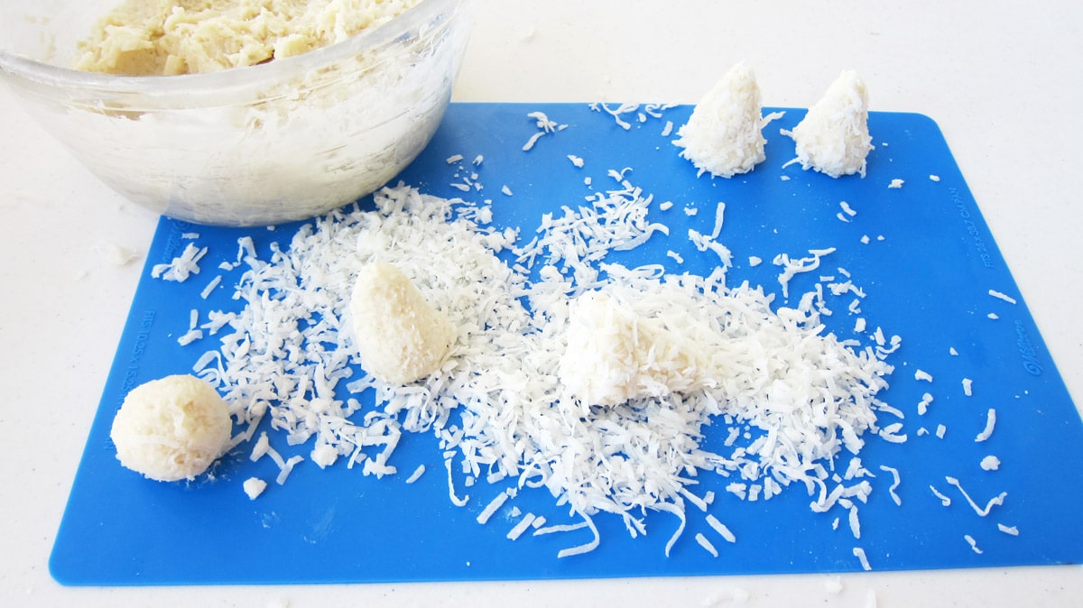 shape creamy coconut candy into balls then into cones and roll in coconut to create candy Christmas trees.