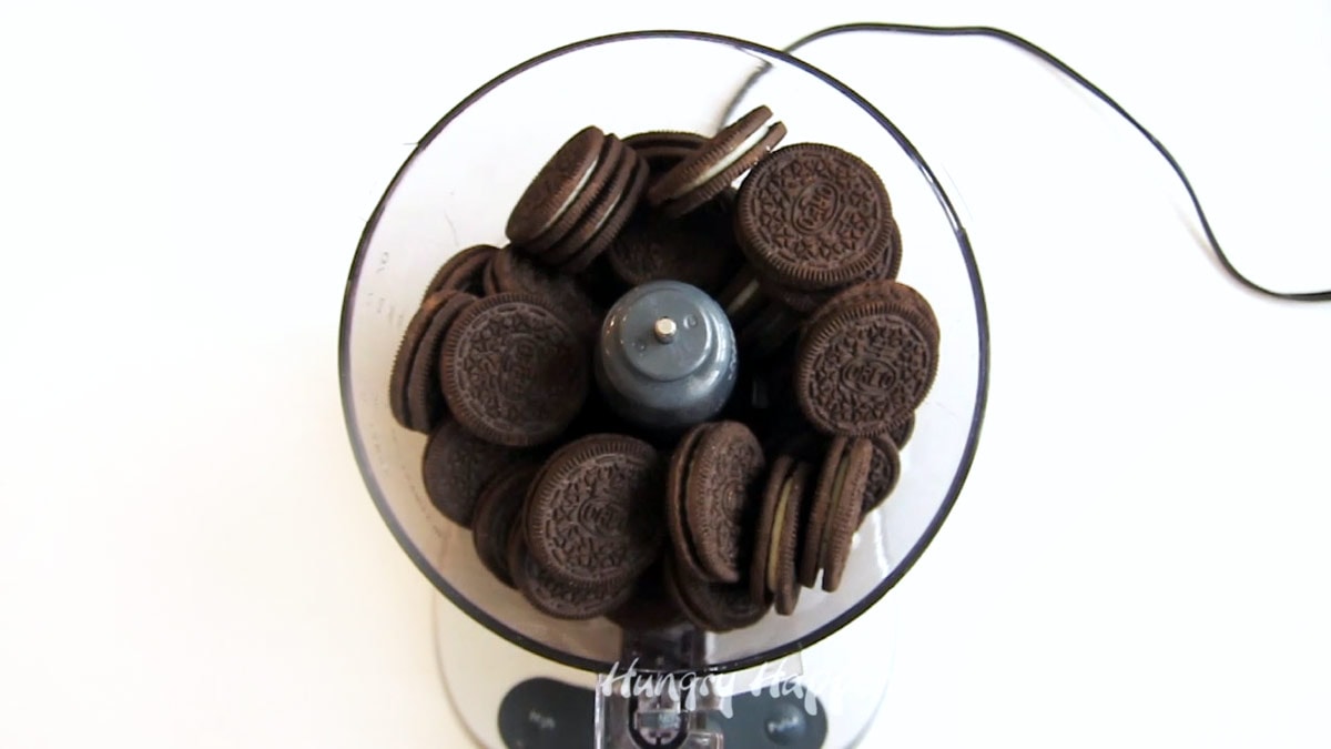 OREO Cookies in the bowl of a food processor.