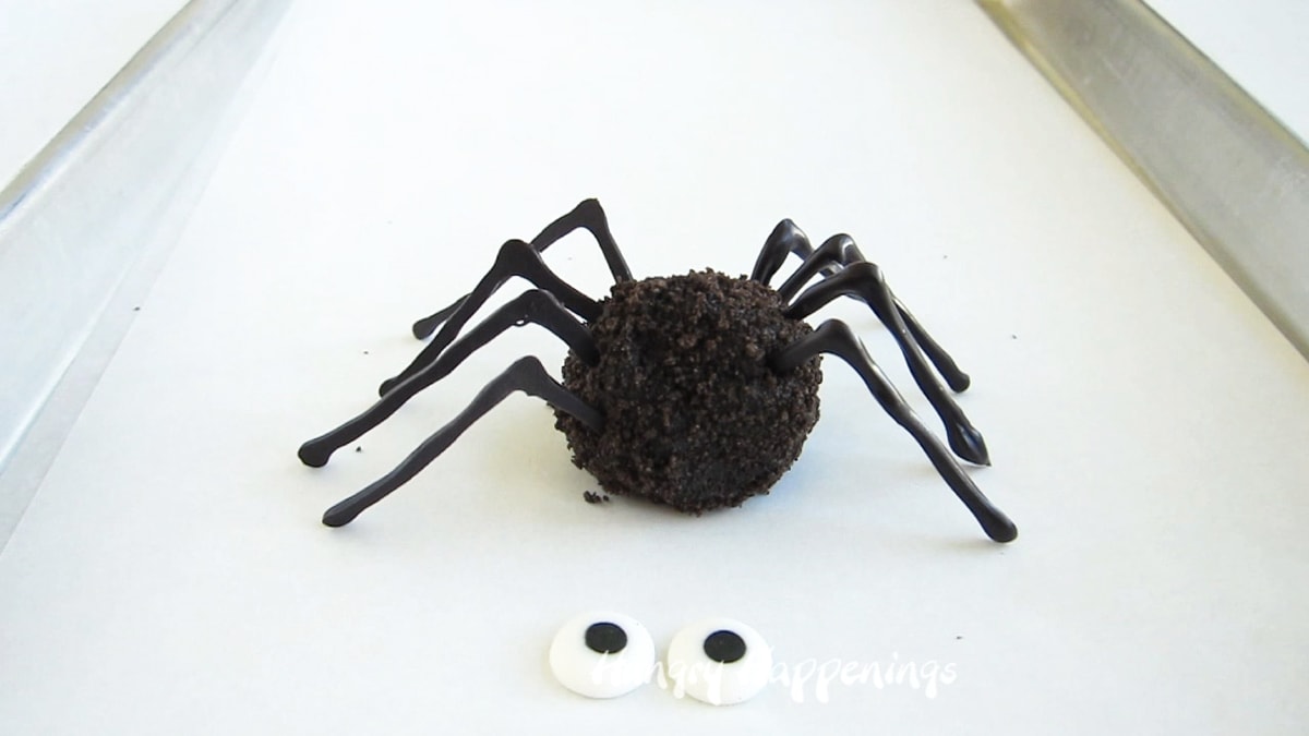 oreo cookie ball with 8 chocolate spider legs attached.
