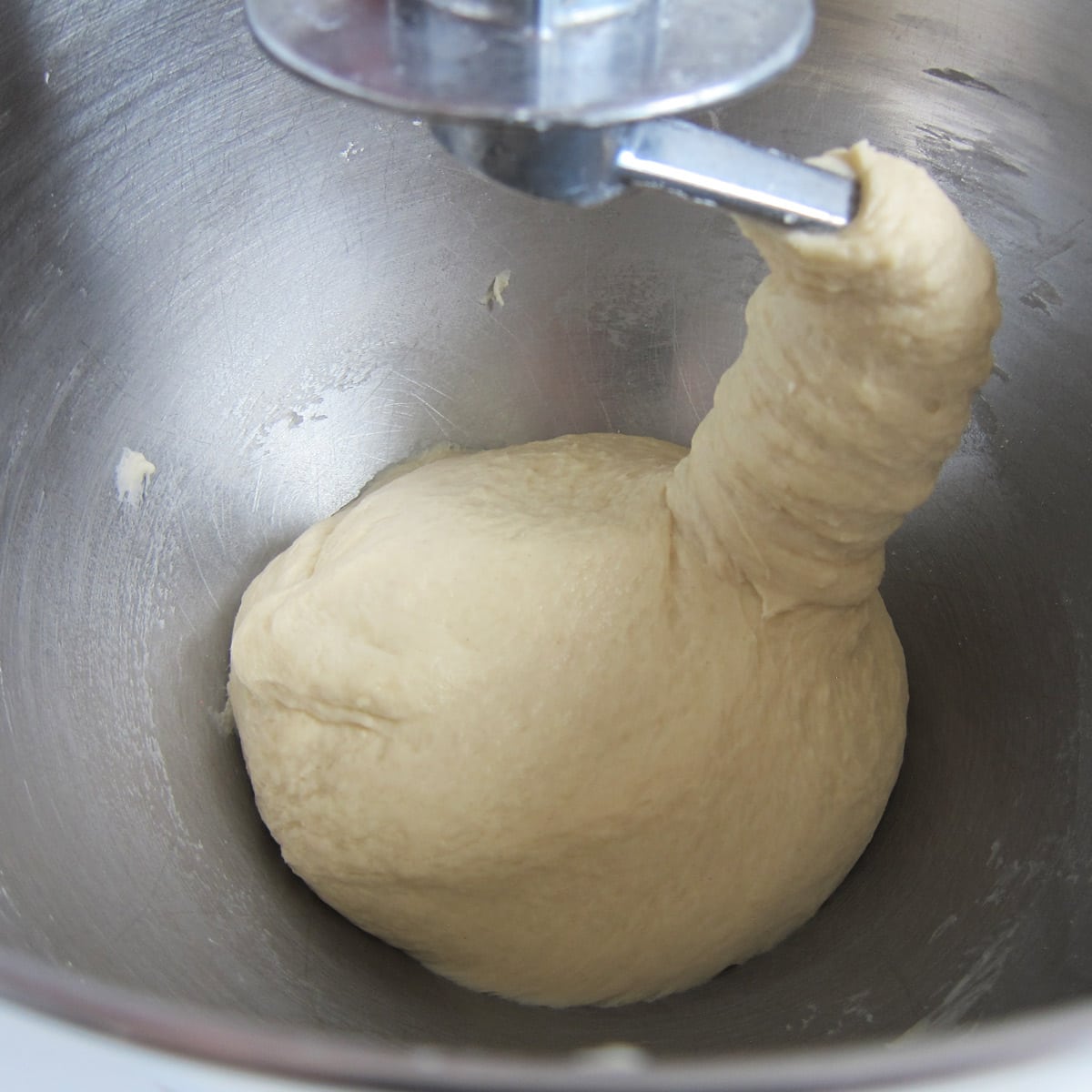 hamburger bun dough kneaded using a stand mixer fitted with a dough hook.