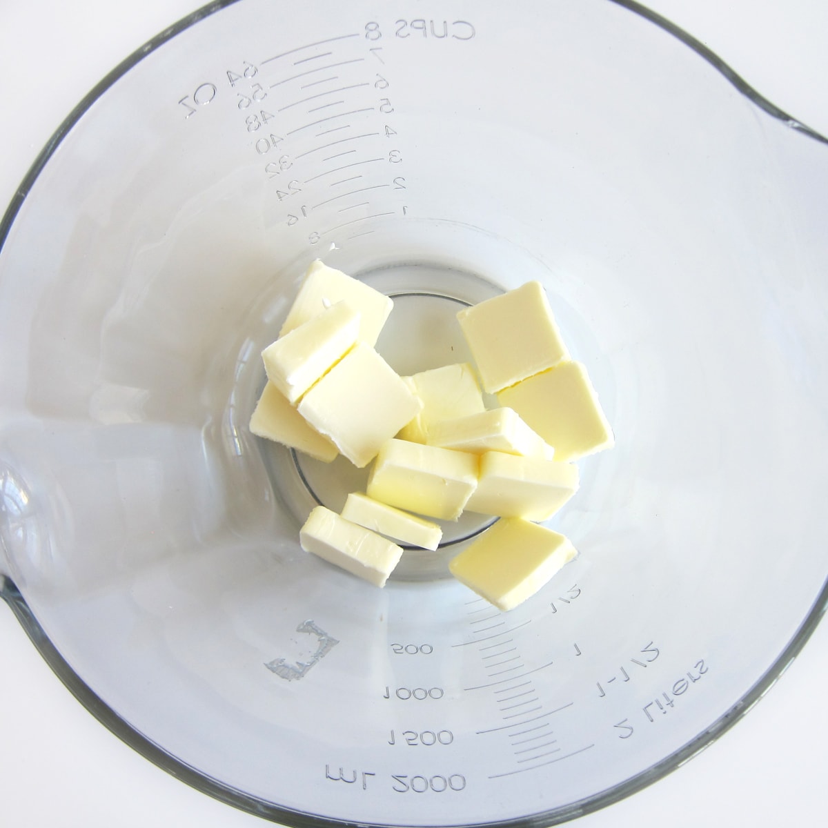 slices of butter in a mixing bowl.