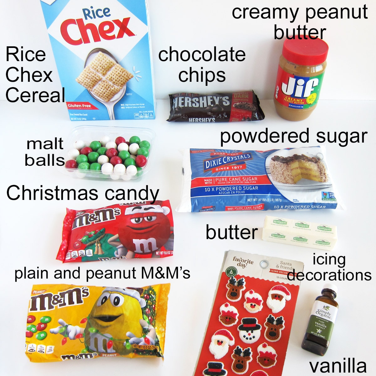 Christmas puppy chow ingredients including Rice Chex Cereal, chocolate chips, creamy peanut butter, powdered sugar, butter, vanilla, and Christmas candy including M&M's, malt balls, and icing decorations.