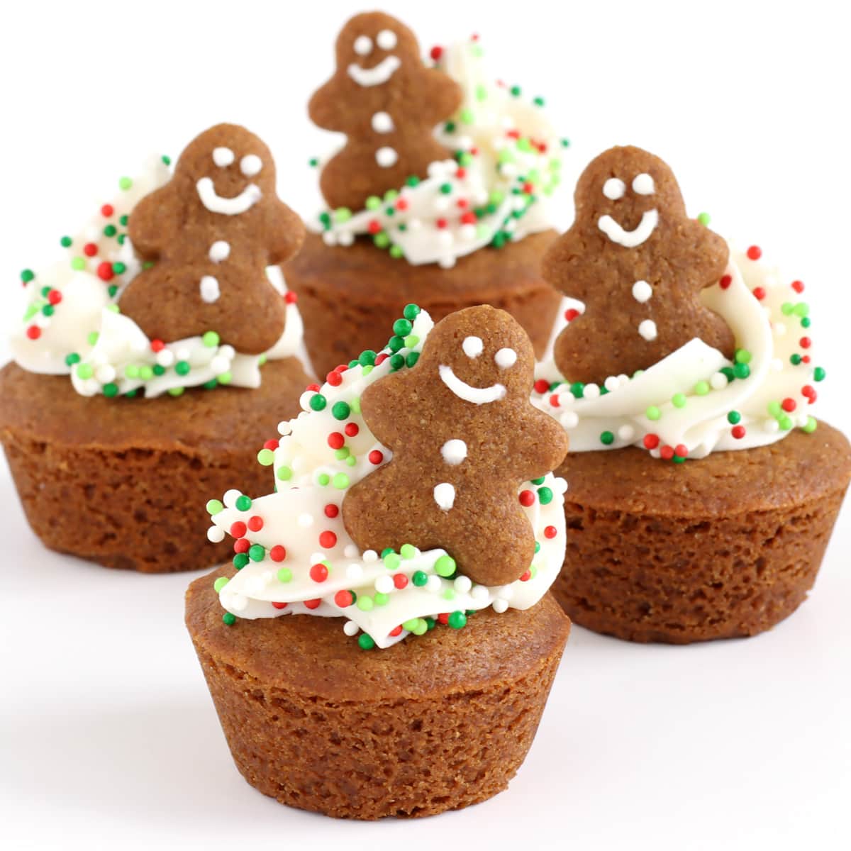 Christmas cookie cups made with bite-size gingerbread cookie cups decorated with frosting a tiny gingerbread men.