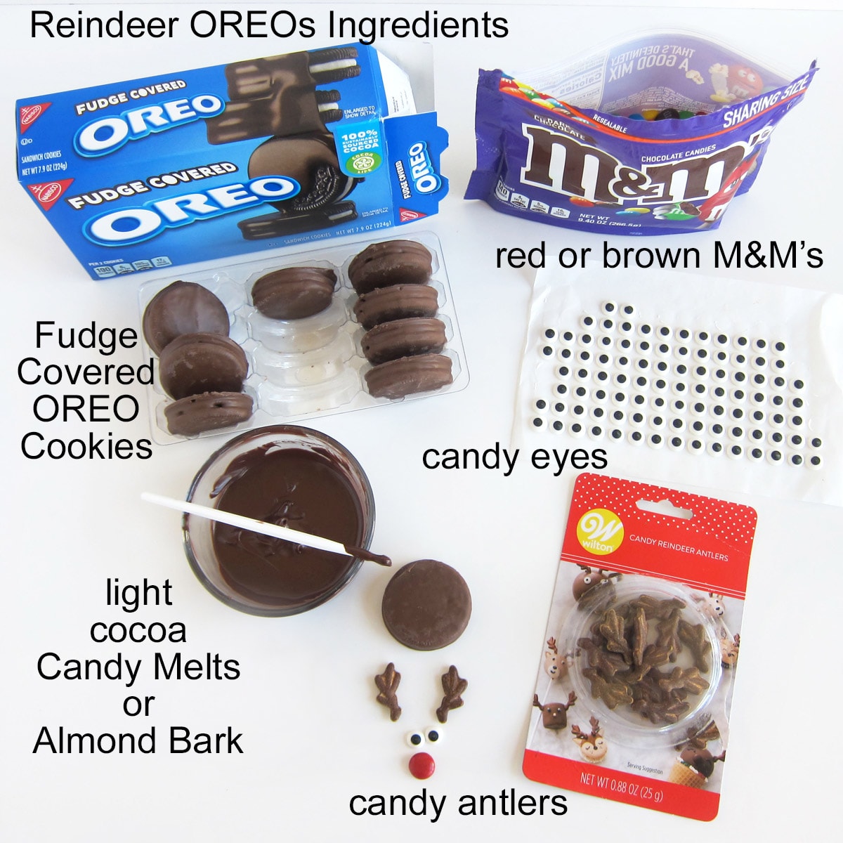 reindeer oreo cookie ingredients including candy antlers, candy eyes, M&M's, candy melts, and fudge covered OREOs. 