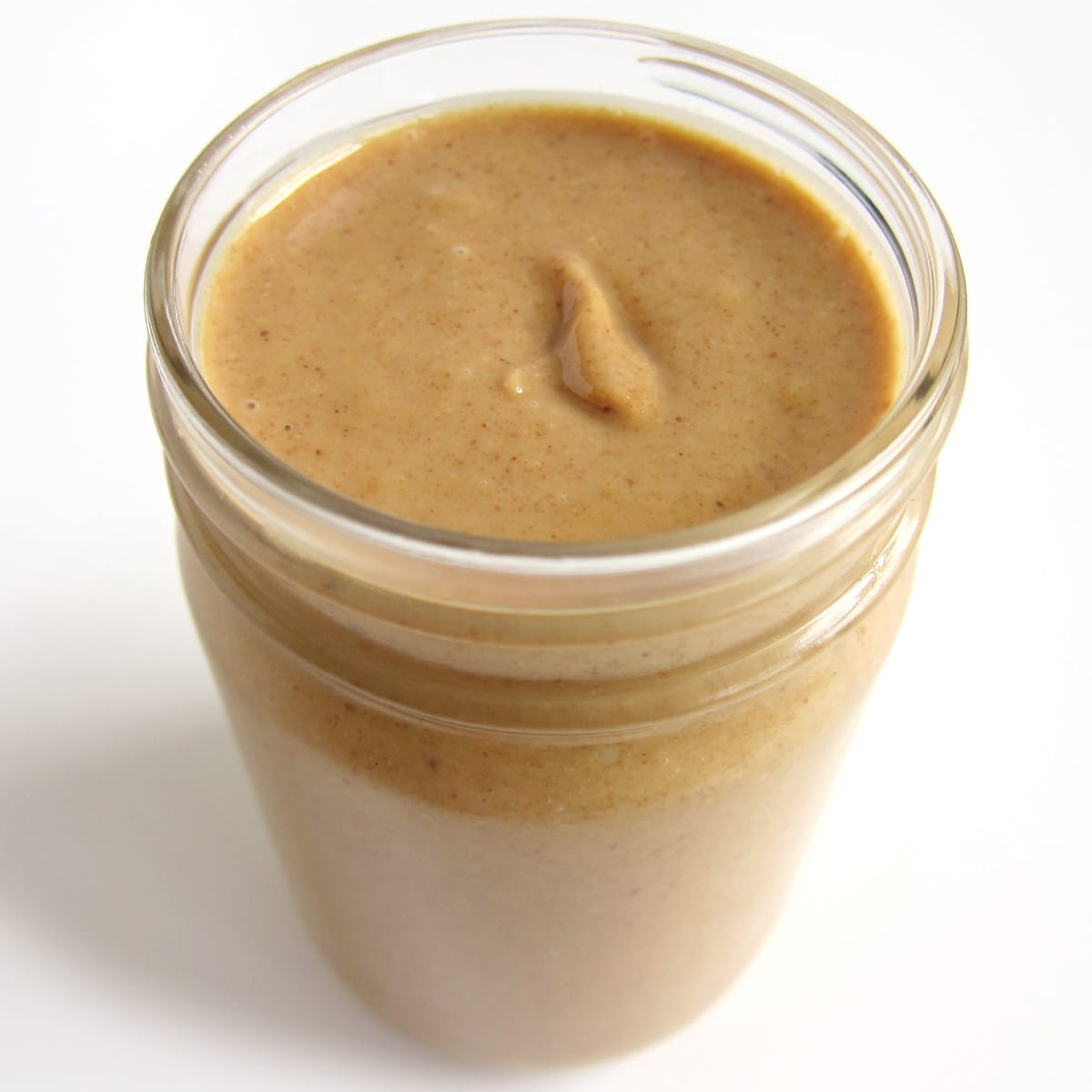 homemade creamy peanut butter in a jar. 