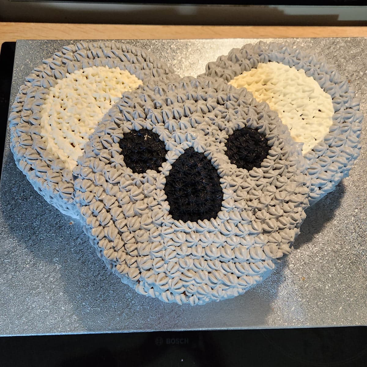 easy koala cake served on a silver cake board